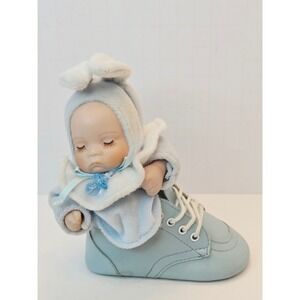 Vintage Musical Wind Up Porcelain Baby Doll in Blue Sneaker Plays Music Moves
